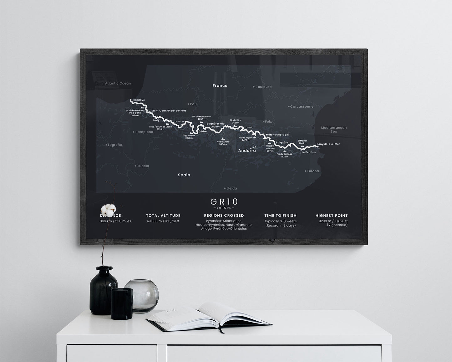 GR10 trek print with black background in living room
