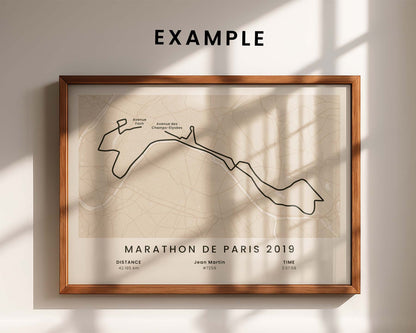 Framed custom marathon poster of the route for Marathon de Paris 2019 on a wall with sunlight casting shadows.