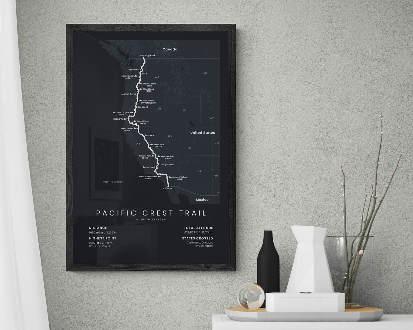 PCT thru-hiking poster map with black bacground in living room